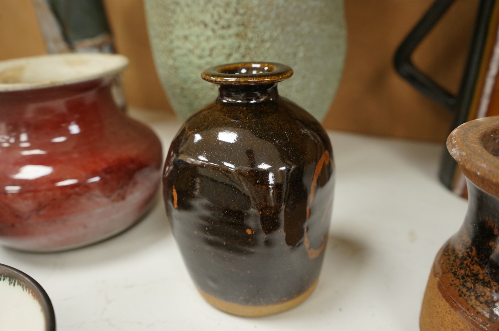 A group of eleven pieces of mixed 1960's-80's pottery to include vases, jugs and two rectangular dishes, largest 34cm high